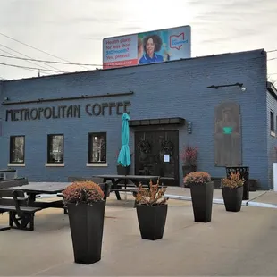 The coffeehouse&apos;s exterior with a drive through and outdoor seating for when it&apos;s the right thing to do (2021)