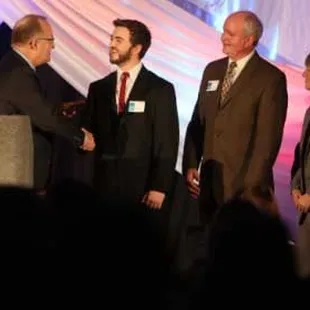 Zac receiving the Hutchinson Chamber of Commerce&apos;s 2013 Small Business of the Year award on behalf of Metropolitan Coffee