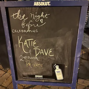 Cute sign out front for bride &amp; groom. Inside chalkboard too.