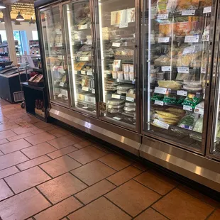 a display of cheeses and other foods