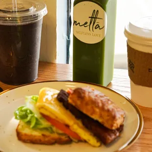 a sandwich and a drink on a table