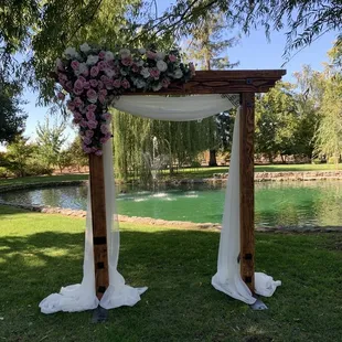 a wedding arch decorated with flowers