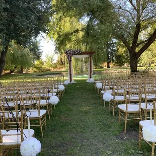 a wedding ceremony set up in the garden
