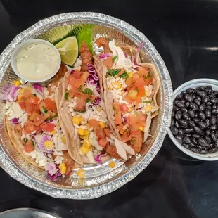 Beer Battered Fish Tacos (3). Corn tortillas, white fish, purple &amp; green cabbage, corn, queso fresco, pico, creamy avocado sauce. $11.50.