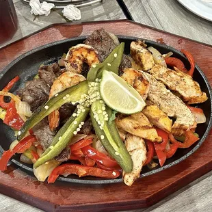 Beef and chicken fajitas for two. That pepper on top is grilled and it is so very hot.