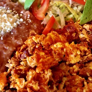 Huevo con chorizo (eggs & chorizo): delicious! Some of the best I've had. Usually comes with rice.