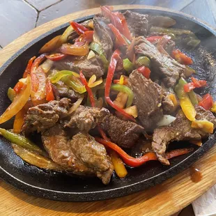 Steak Fajitas--tender, high quality beef!  Just onions and peppers, I left off the beans, rice and torillas!