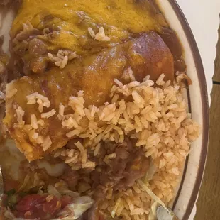 Taco, enchilada with beans and rice.