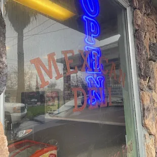 a neon sign in the window