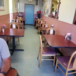 a man sitting at a table in a restaurant