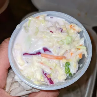 a person holding a bowl of food