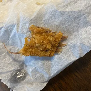 a piece of food on a piece of wax paper