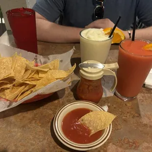 Virgin strawberry daiquiri, virgin pina colada, chips and Complementary Salsa