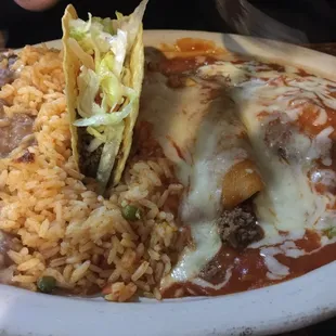 Beef enchilada with chili releno and taco