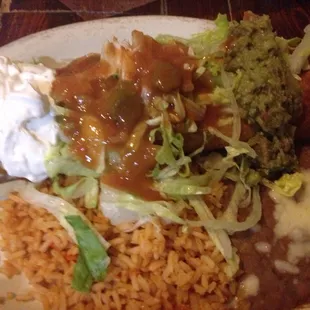 Chicken Chimichanga w/guacamole, beans, and rice.