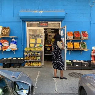 a woman standing in front of a store