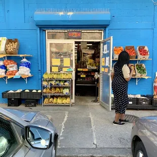 a woman standing in front of a store