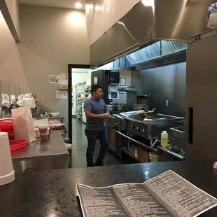 a man standing in a kitchen