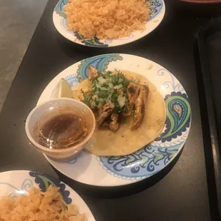 Chicken taco with Mexican rice.