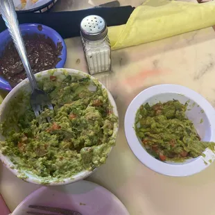 two examples of guacamole, small portion was old and aged; large portion was made today yet still tasted terrible