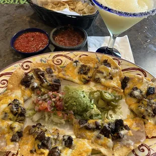 Steak nachos and a margarita...Both good.