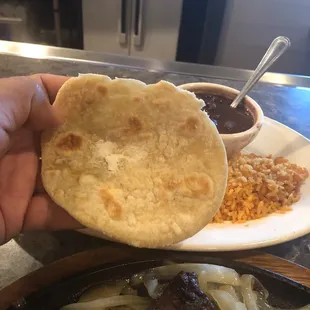 Tiny little flour tortillas (thick, almost like gorditas/pupusas). They need to improve here.