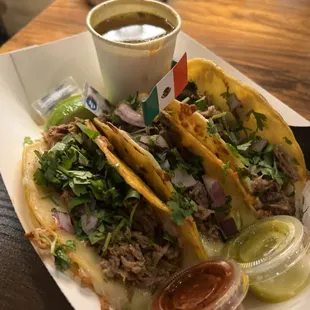 a plate of tacos and salsa