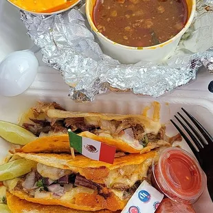Queso tacos with birria and consomé