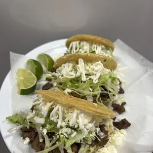 Steak gorditas with lettuce, cheese and sour cream!