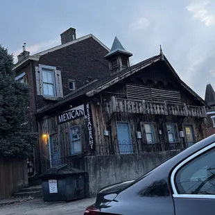 Back lot parking and back view of restaurant