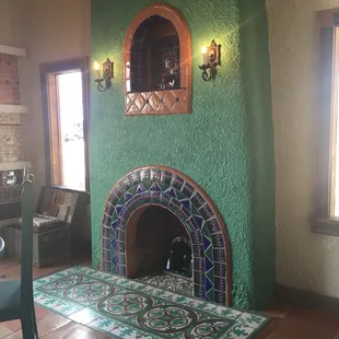 Mexican tile design, for a fireplace with cement tile as a hearth.