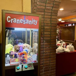 a claw machine with stuffed animals