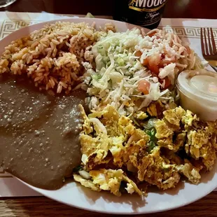 Chilaquiles. The refried beans are beautifully smoky, but the eggs were overcooked. There is a lot here to like, though.