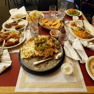 Left: chicken milanesa &amp; fried mushrooms Middle: super nachos Right: beef tacos w/ cheese added &amp; the plate of guac