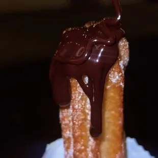 Fresh churro with chocolate dip