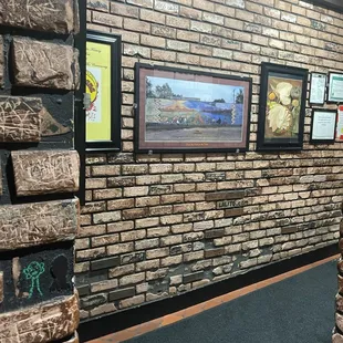 Look closely at the bricks: each is unique and each tells a story.