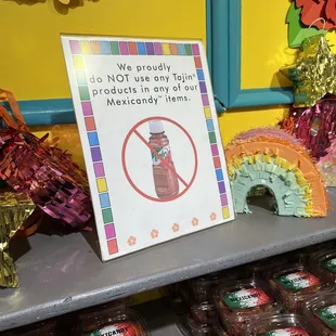a sign on a shelf in a store