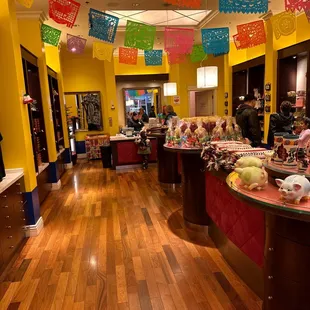 a brightly colored room with a wooden floor