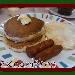 a plate of food with eggs, sausages and pancakes