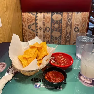 a bowl of tortilla and a bowl of salsa