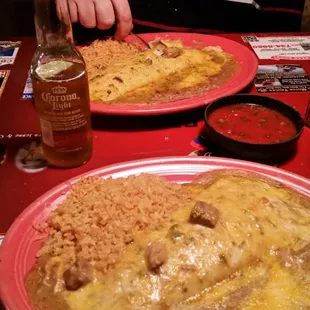 Two smothered egg burritos with two Corona lights. Very very good!