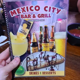 a person holding a menu