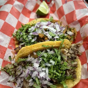 Carne asada and al pastor taco