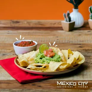 a plate of chips and guacamole