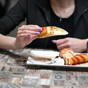 a woman eating a piece of pizza