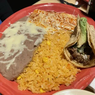 Combination plate with Taco Asada and Enchilada, served rice and bean.