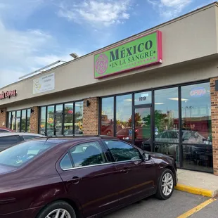 a car parked in front of a mexican restaurant