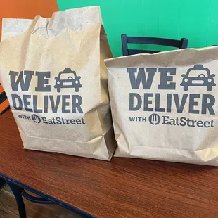 two bags of food on a table