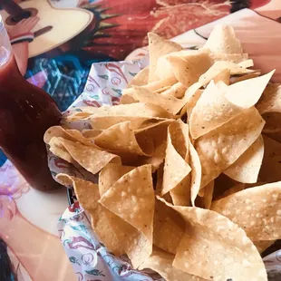 a plate of chips and a drink