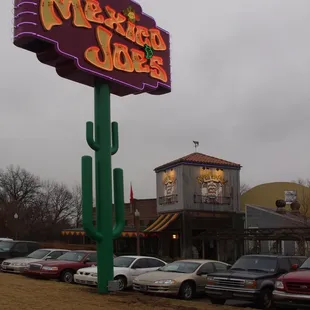 cars parked in front of a restaurant